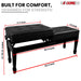 Elegant piano bench with cushioned seat and hidden storage compartment for sheet music and accessories